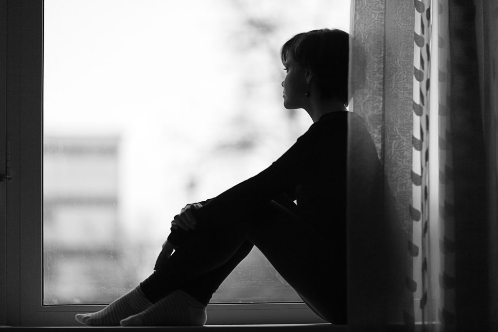 Woman sitting by a window